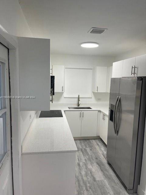 Investment opportunity ! Totally updated modern clean and sleek kitchen with quartz countertops and fully upgraded bathrooms and a NEW ROOF !