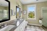 Bathroom with a shower stall and double vanity