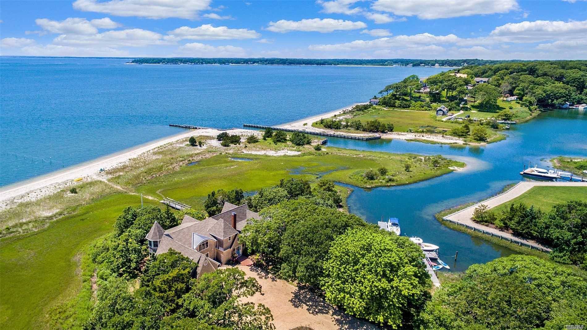 Over the wooden bridge, ensconced in the natural environment of the Great Peconic Bay, a sandy beach, and lush wetlands, Bridges to Bliss blends seamlessly into the landscape.