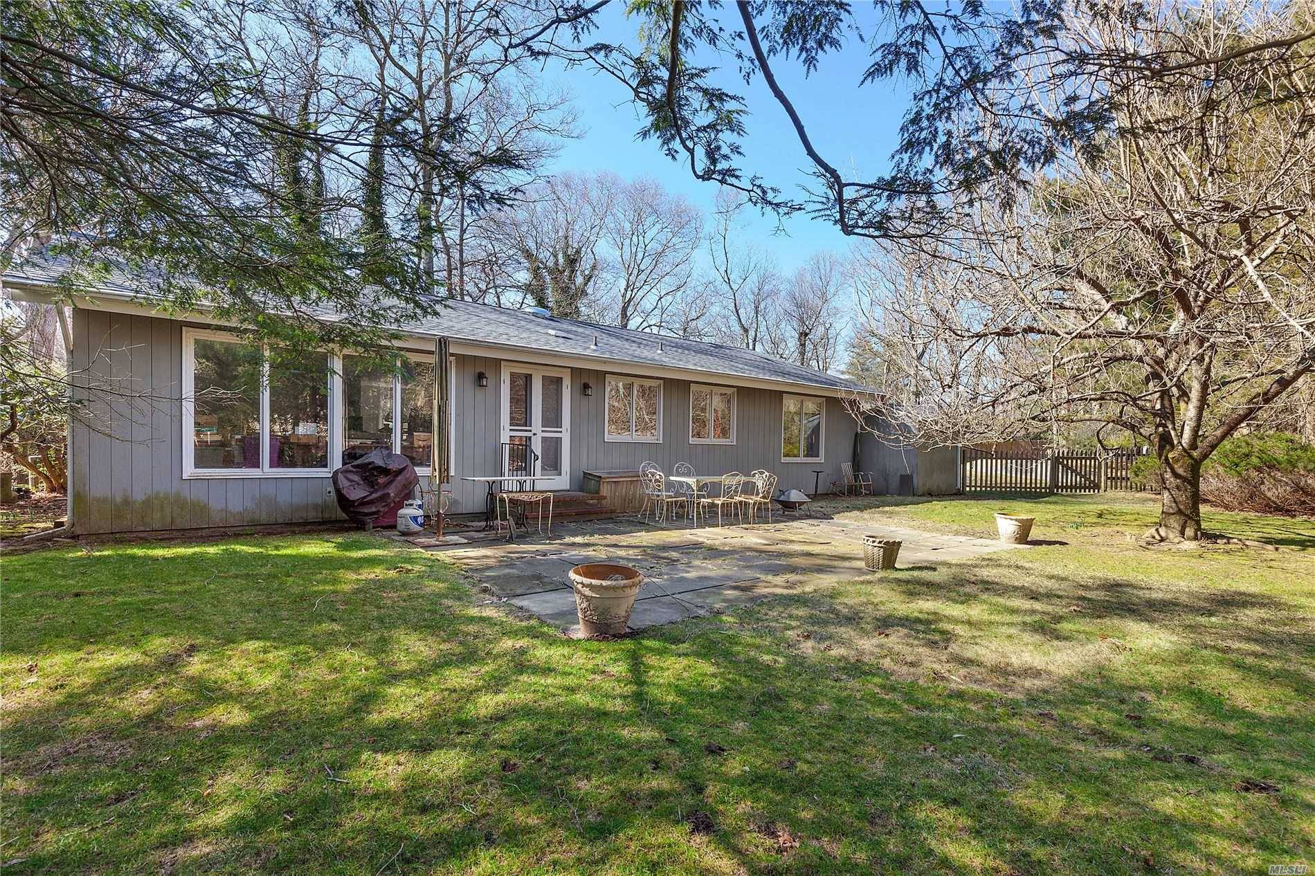 A mid 20th century ranch nestled on a pristine half acre in the Georgica section of East Hampton Village, location AAA.