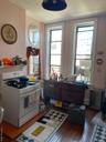 Kitchen featuring range and dark wood-type flooring