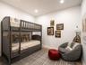 Bedroom with wood finished floors and recessed lighting