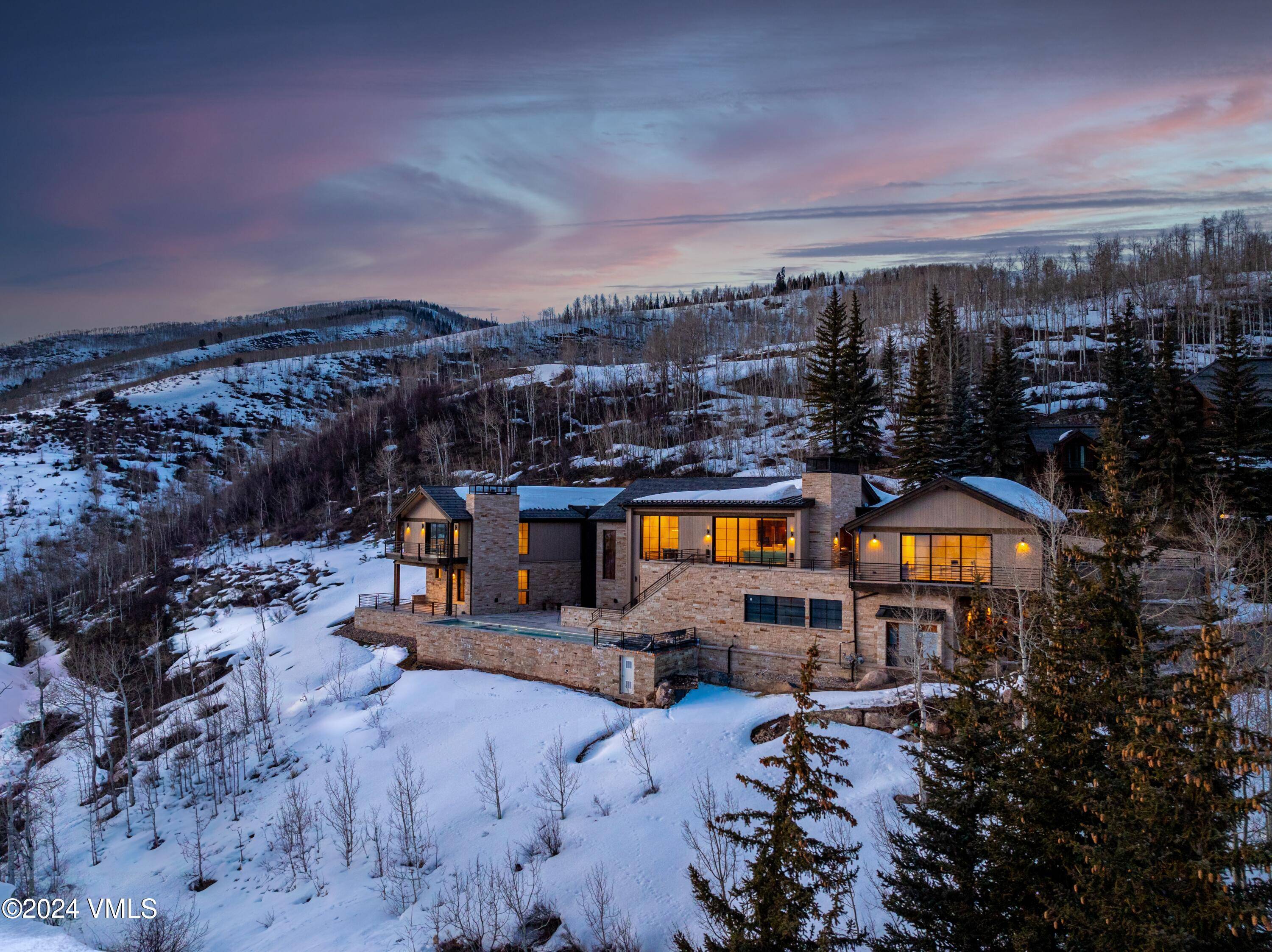 Perched at the top of Spraddle Creek Estates on over 6 acres stands Vail's newest and most spectacular custom home, offering the most remarkable views of Vail Mountain.