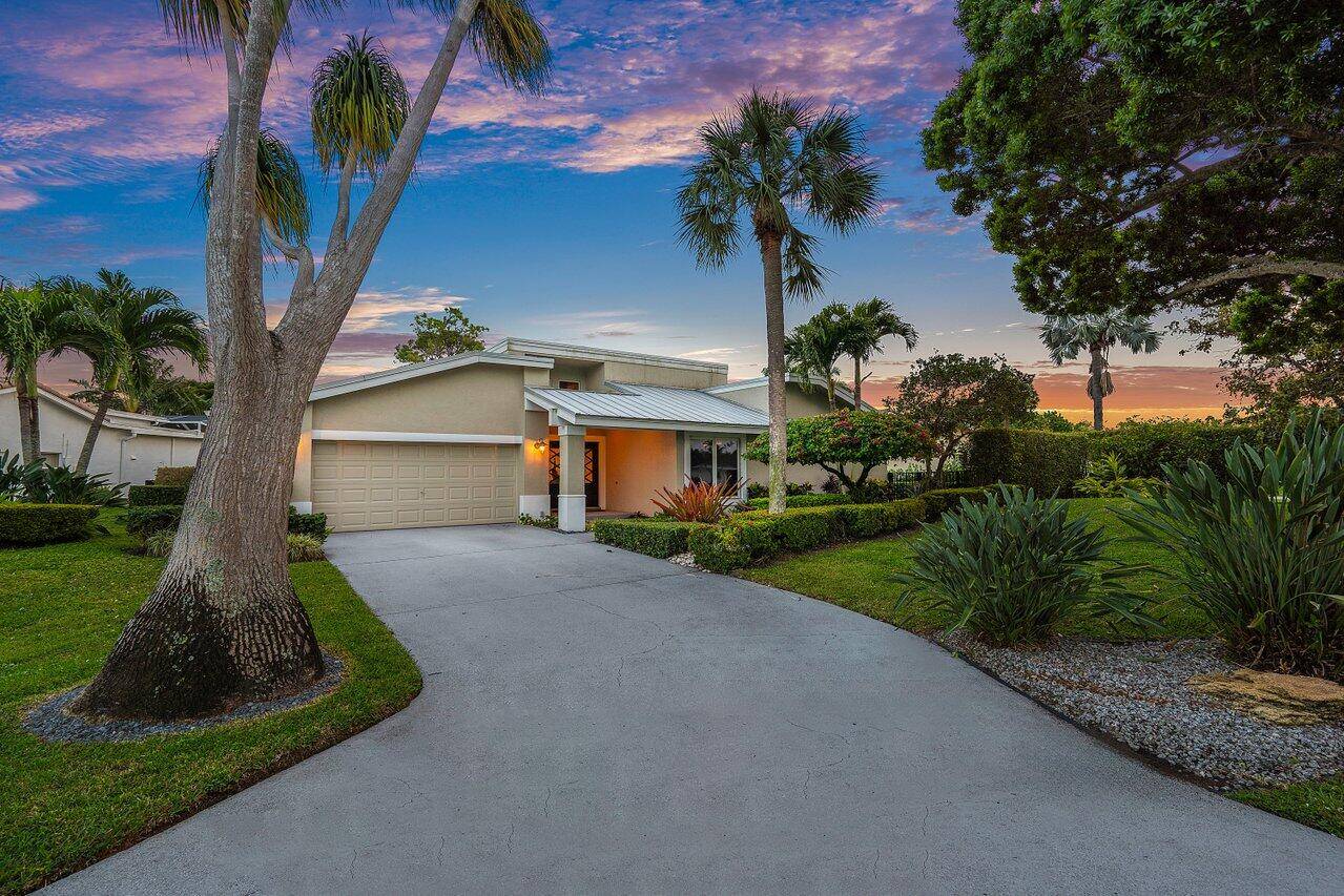 A well designed home on a quiet street in desirable Seagate Country Club.