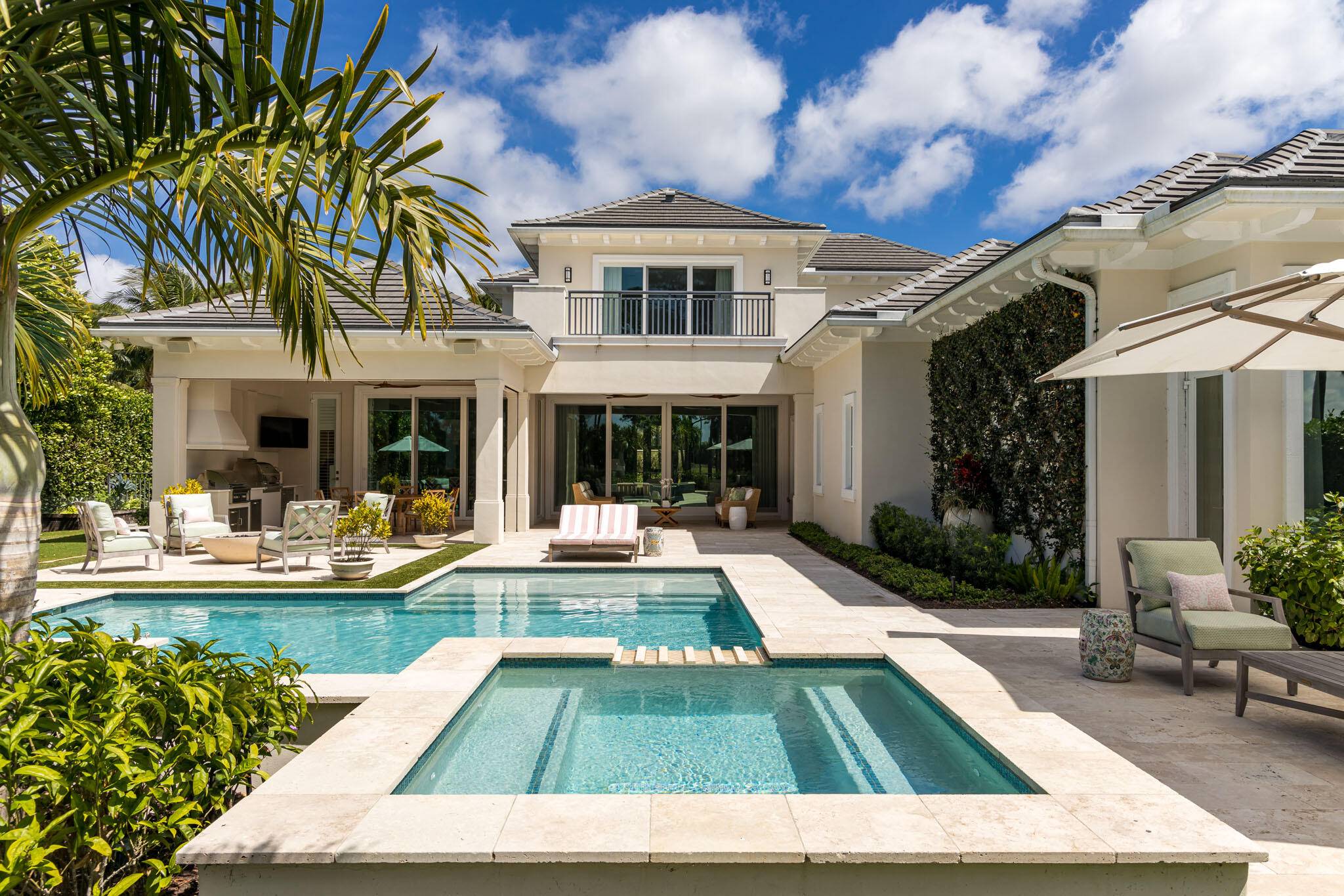 Spectacular 2 story British West Indies style estate in Old Palm Golf Club.