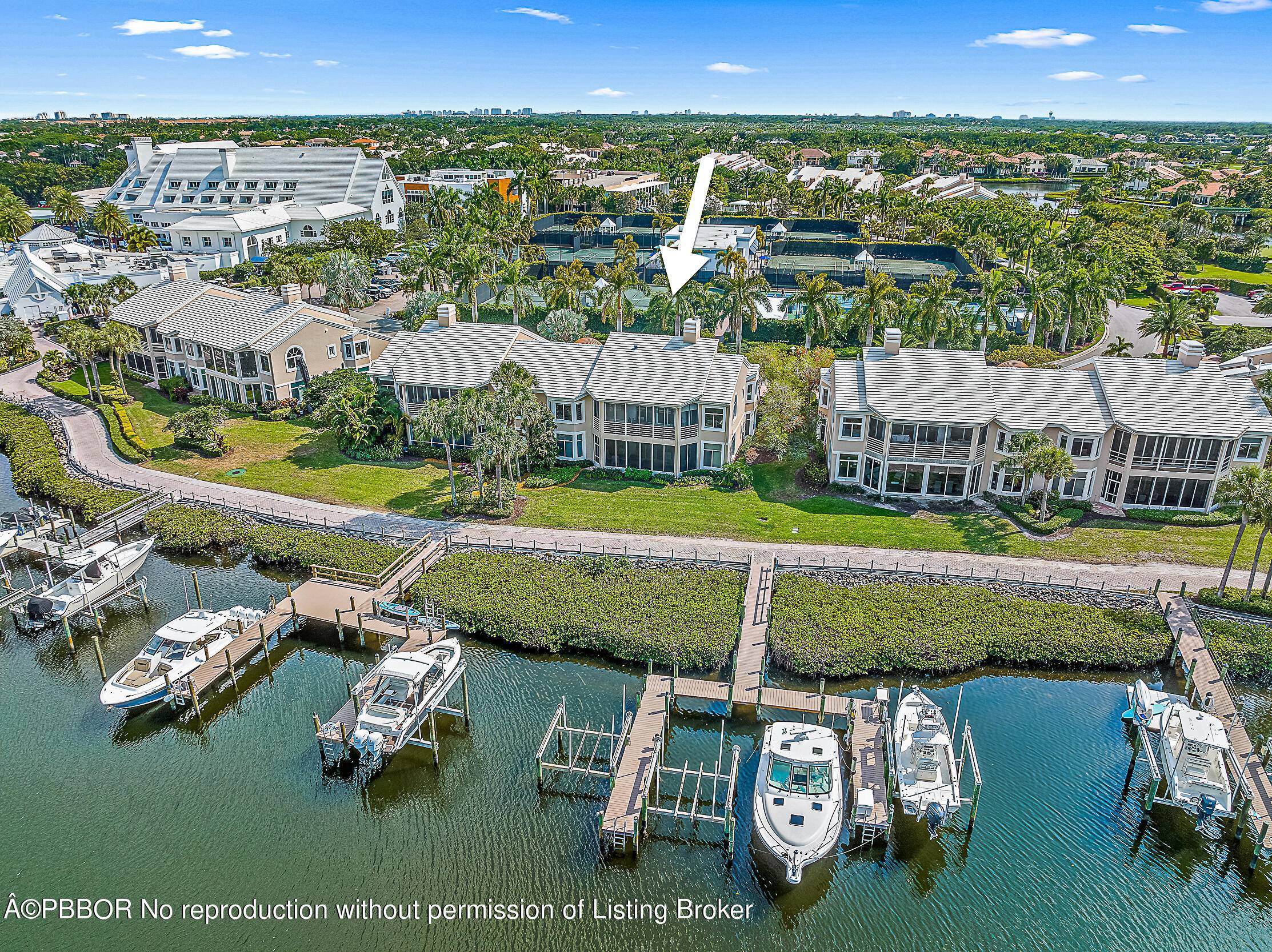 Embrace sophisticated living in this stunning second floor harbor home, beautifully renovated to perfection in the esteemed Admirals Cove.