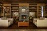 featuring a fireplace, floors, built in shelves, and wood ceiling