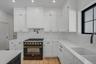 Thoughtfully designed kitchen featuring clean finishes, modern cabinetry, and an open layout that connects seamlessly to the dining area and main livi