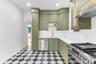 Upper level custom eat-in kitchen with stainless steel appliances