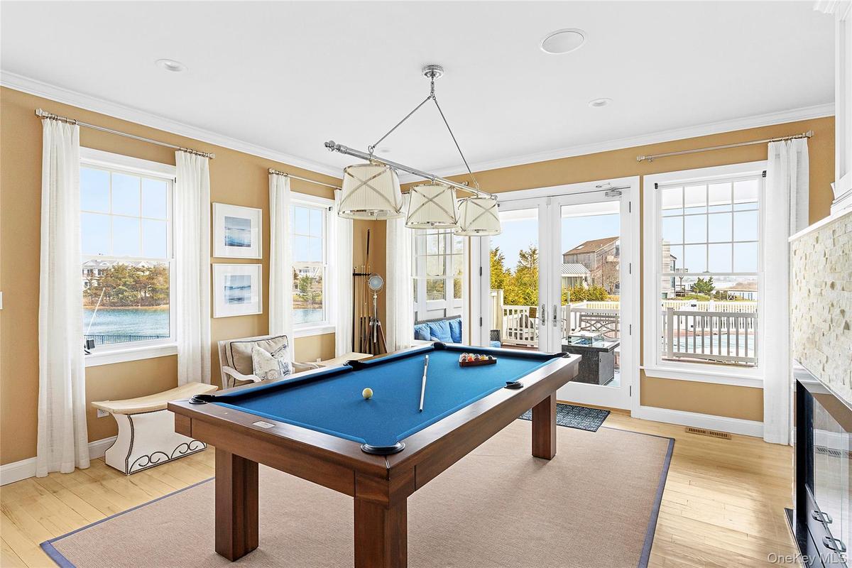 Pool Table with Access to Backyard Deck