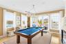 Pool Table with Access to Backyard Deck