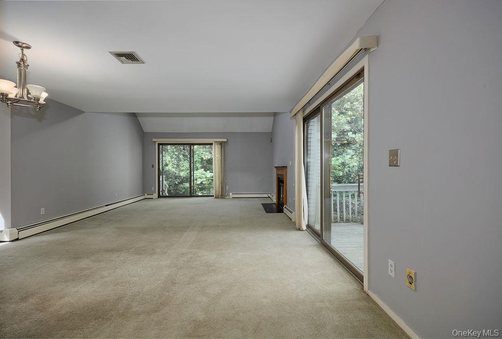 Spacious Living Room with SGD to two decks