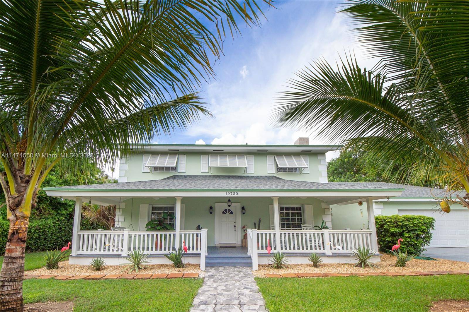 Charming Key West style Redland estate home with an inviting front porch.