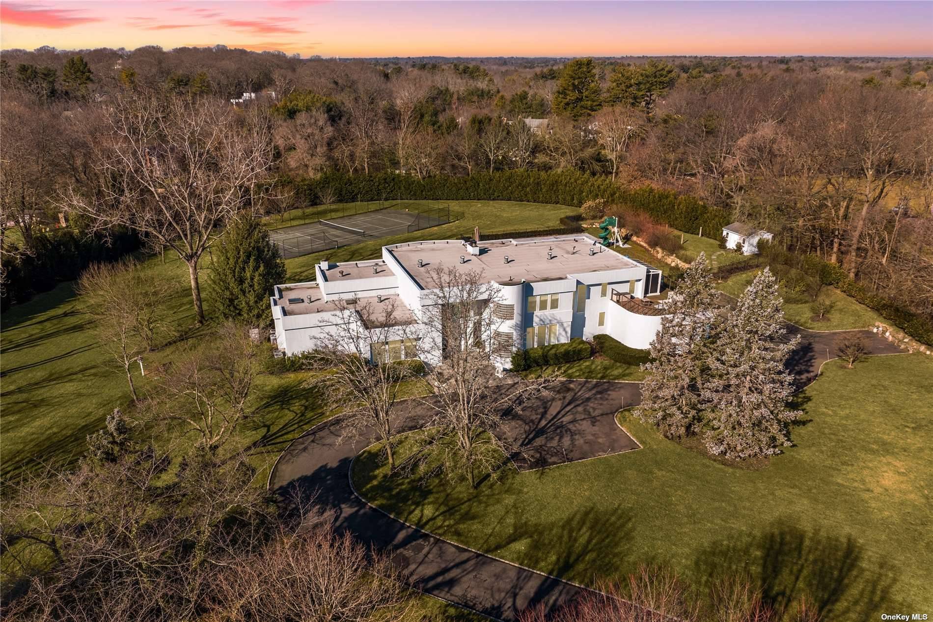 Welcome to this SPECTACULAR and sun filled contemporary smart home, with walls of glass overlooking almost 4 acres of sweeping emerald lawns, perfect for relaxation amp ; entertaining.