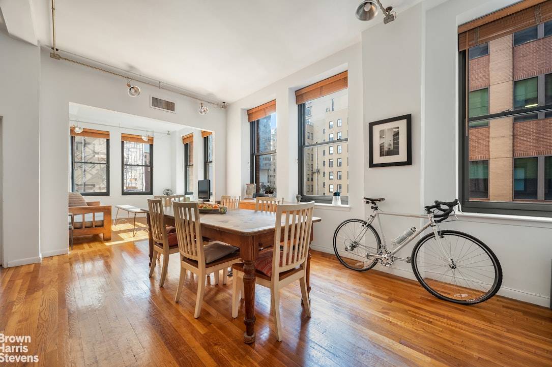 Welcome to this stunning corner loft apartment, where historic charm meets contemporary comfort.