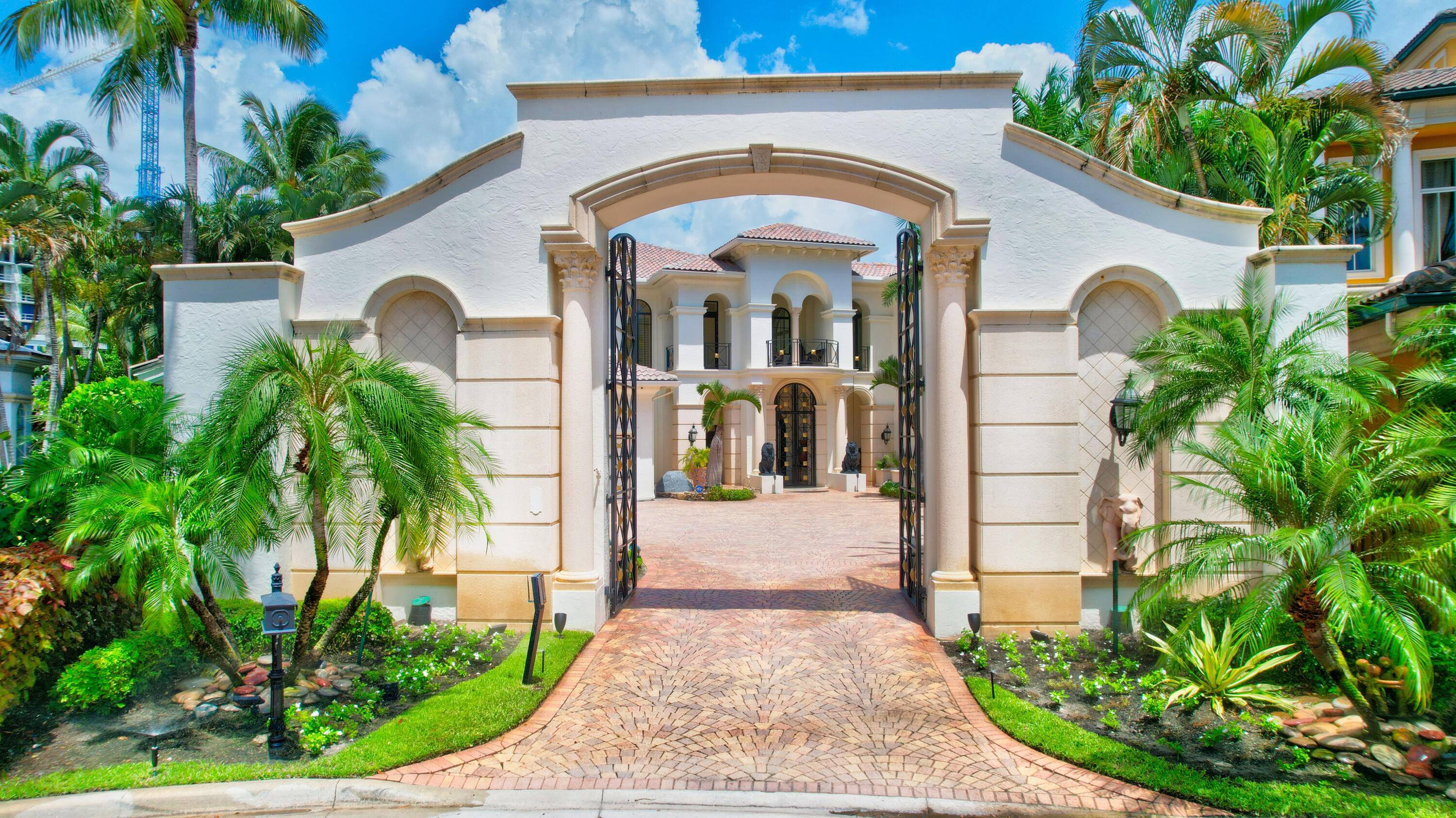 Spectacular Mizner Lake Estates Gated Mansion on the grounds of the famous Boca Hotel Resort and Beach Club with the most incredible Lakefront and Golf Course views.
