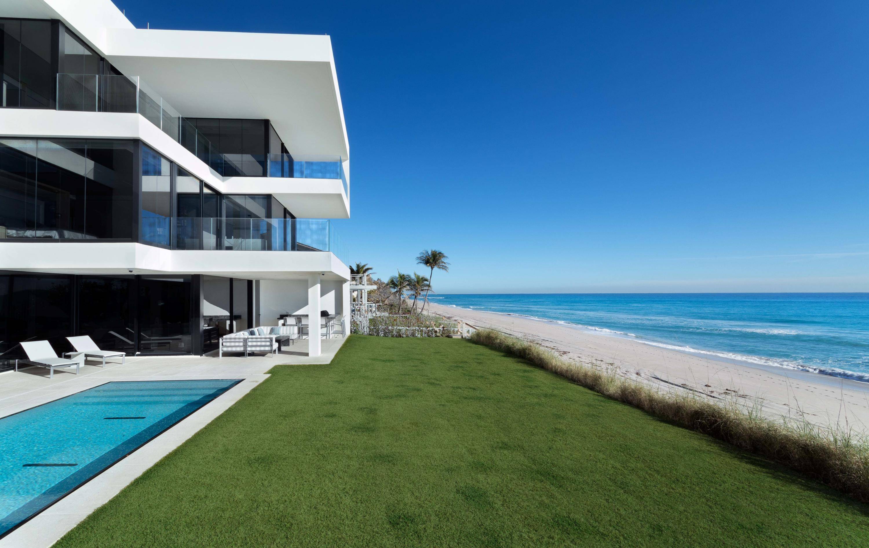THE BEACH HOUSE A Gated Modern Malibu inspired Ocean To Intracoastal Estate sited on 2.
