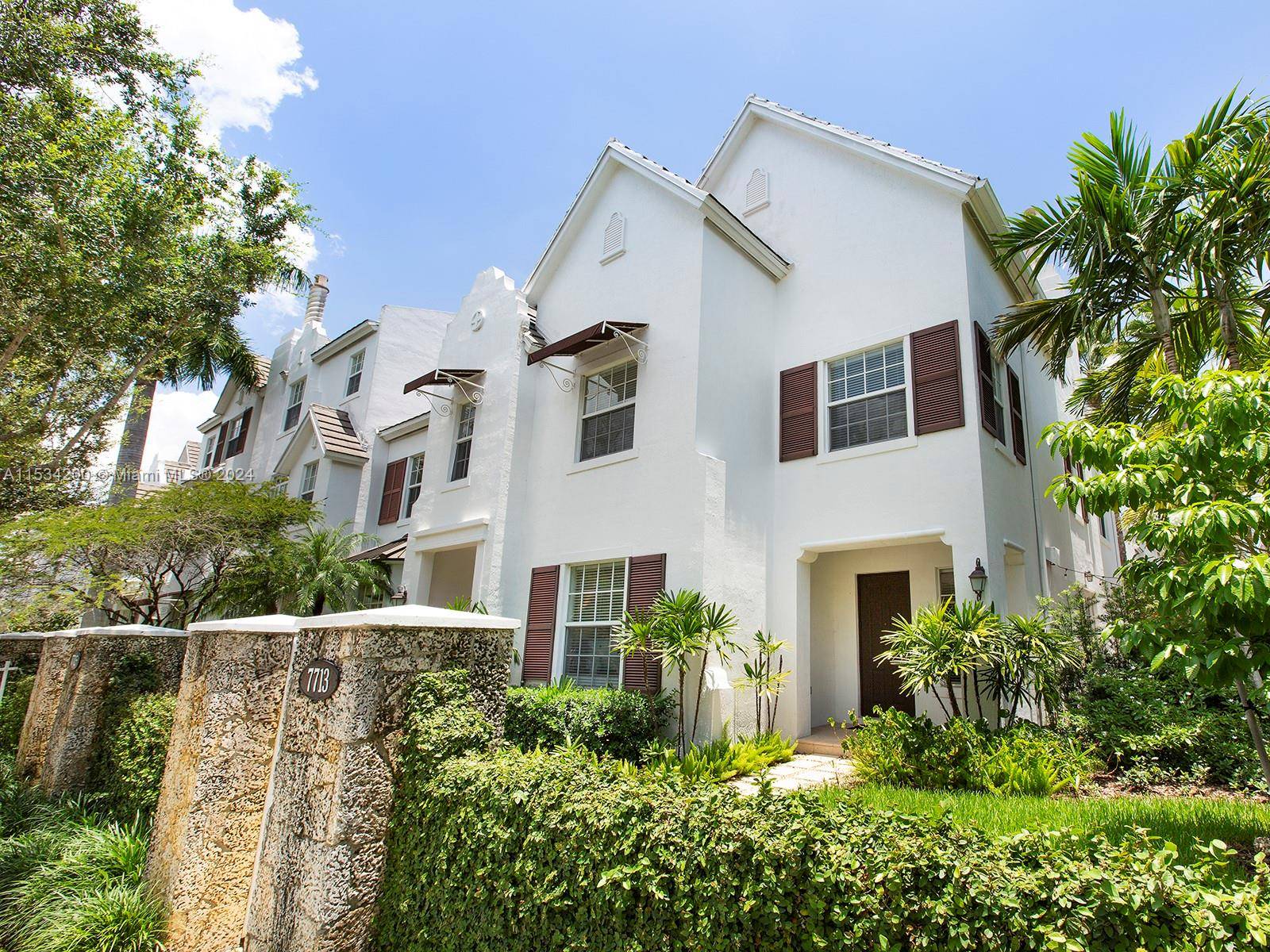 Fabulous corner unit in gated Pine Manor community in South Miami.