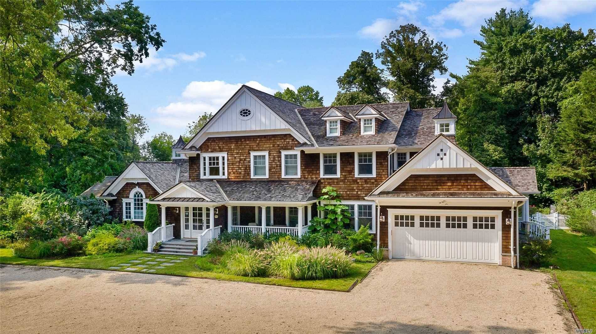 Stunning Hamptons style shingle home in the heart of Old Brookville, NY.