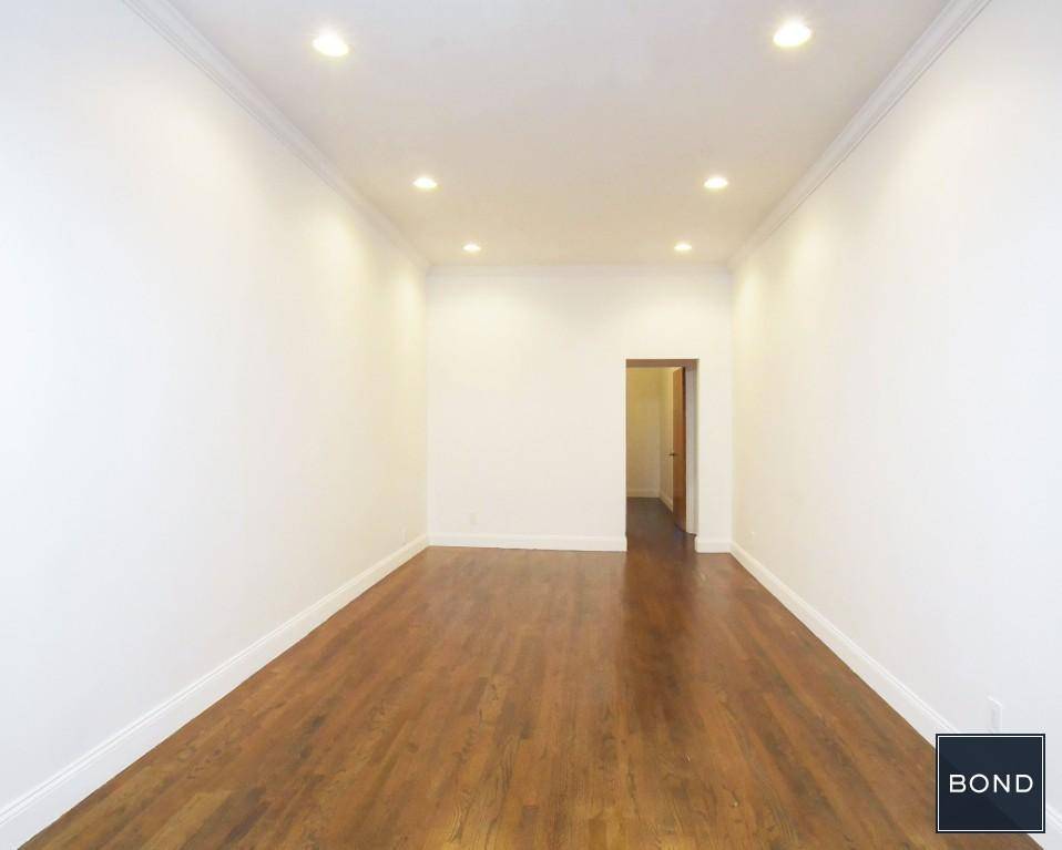 This is a massive newly renovated two bedroom floor through apartment with fireplace !