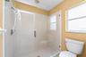 The Primary en suite boasts DUAL CLOSETS, including a WALK-IN, along with a private en-suite bath featuring dual vanities, GARDEN TUB and step-in show
