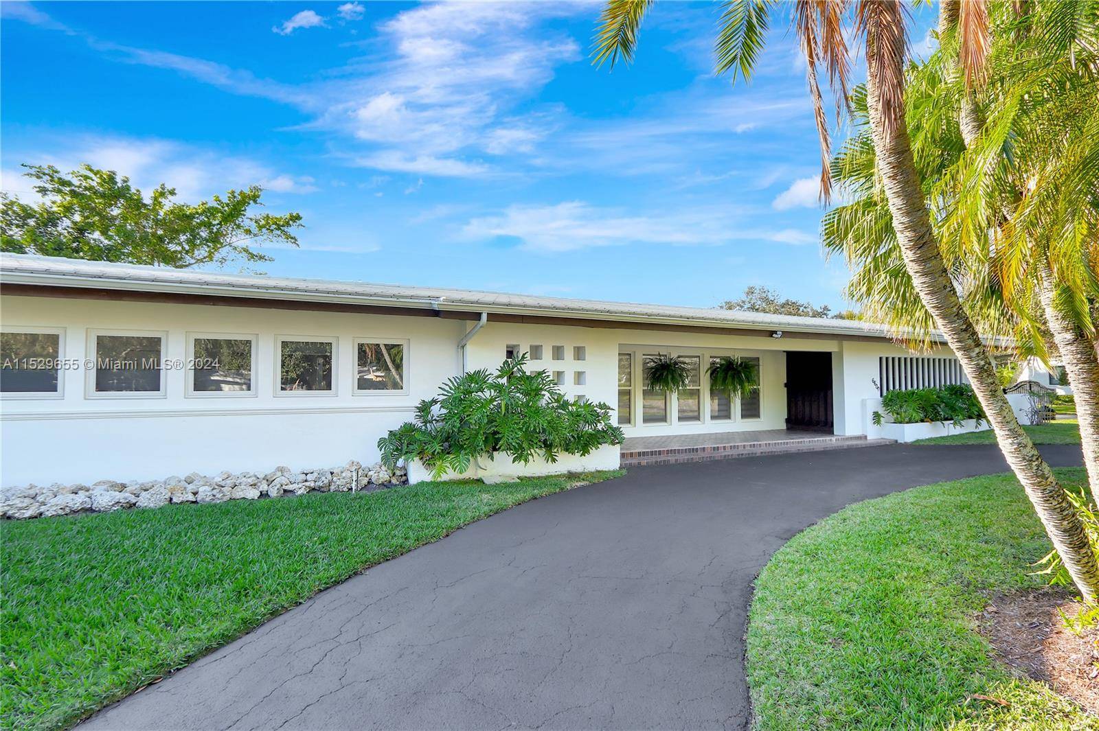 A Must See ! Spacious mid century pool home with lots of hurricane impact windows and natural light is located in the highly desirable South Gables area.