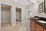Primary en-suite with his & hers closets
