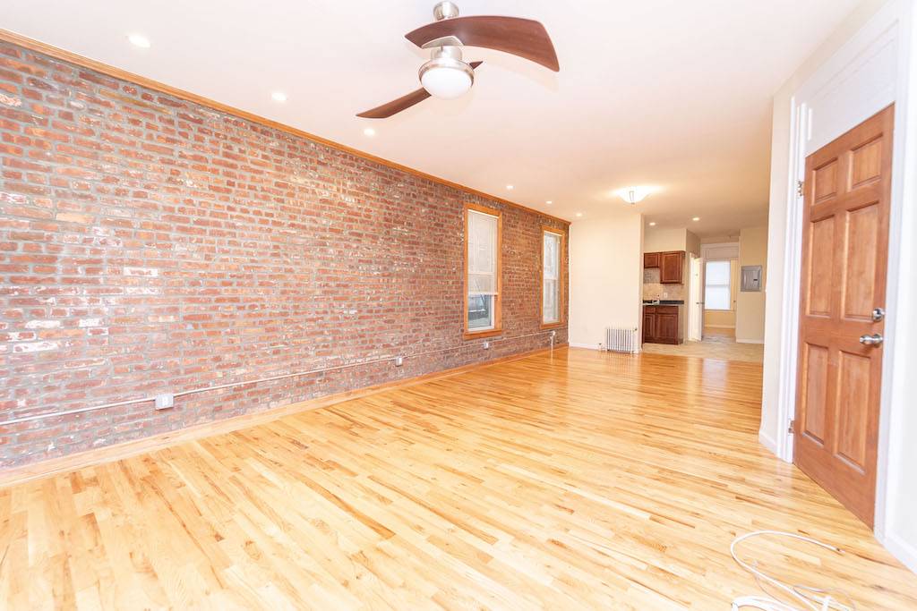 2 Bedroom with exposed brick and giant living room now available off 30th avenue station.