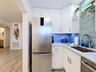 Your special order refrigerator fits perfectly in this custom kitchen that offers all of the amenities of larger kitchens.