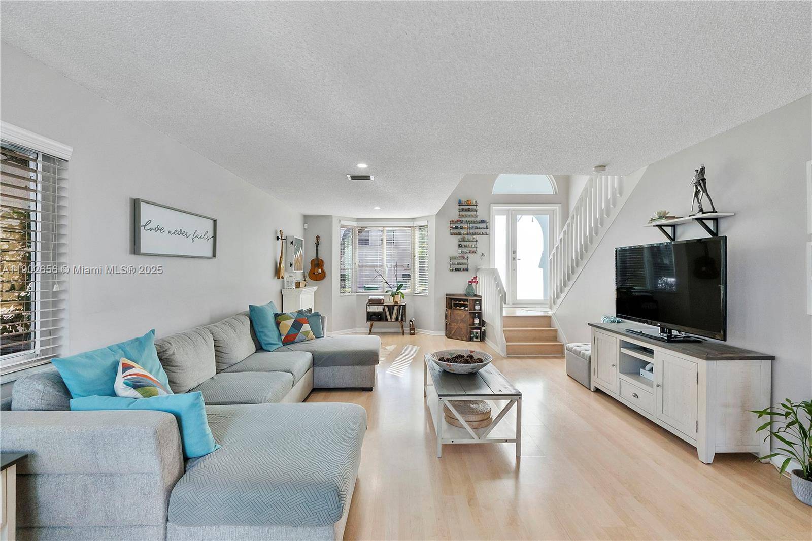 Beautifully turnkey 3 bed 21 2 bath home featuring newly installed impact window patio doors.