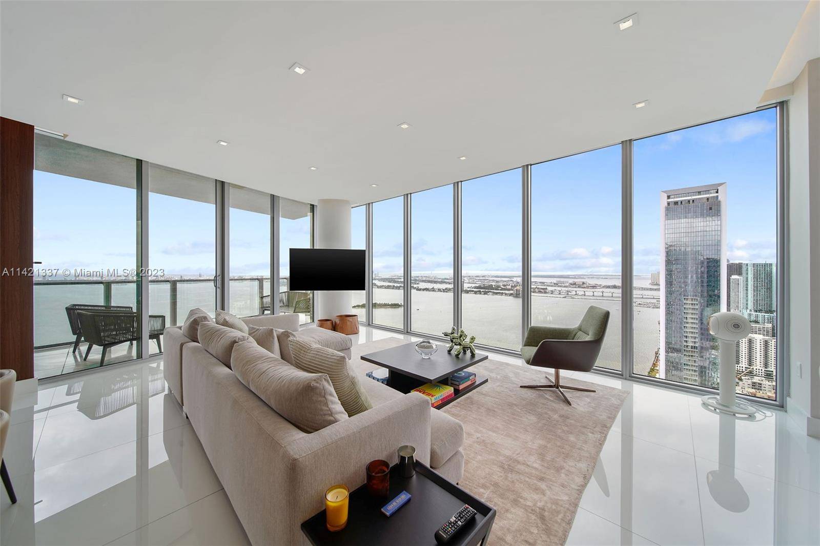 SPECTACULAR HIGH FLOOR BAY SKYLINE VIEWS FROM THIS DESIGNER DESIGNED AND UPGRADED CORNER 3 BED DEN 4 BATH CONDO IN THE MOST COVETED LINE OF EDGEWATER, MIAMI.