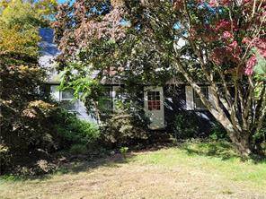 A small old Cape Cod Style home sits on 56 Acres beautiful land.