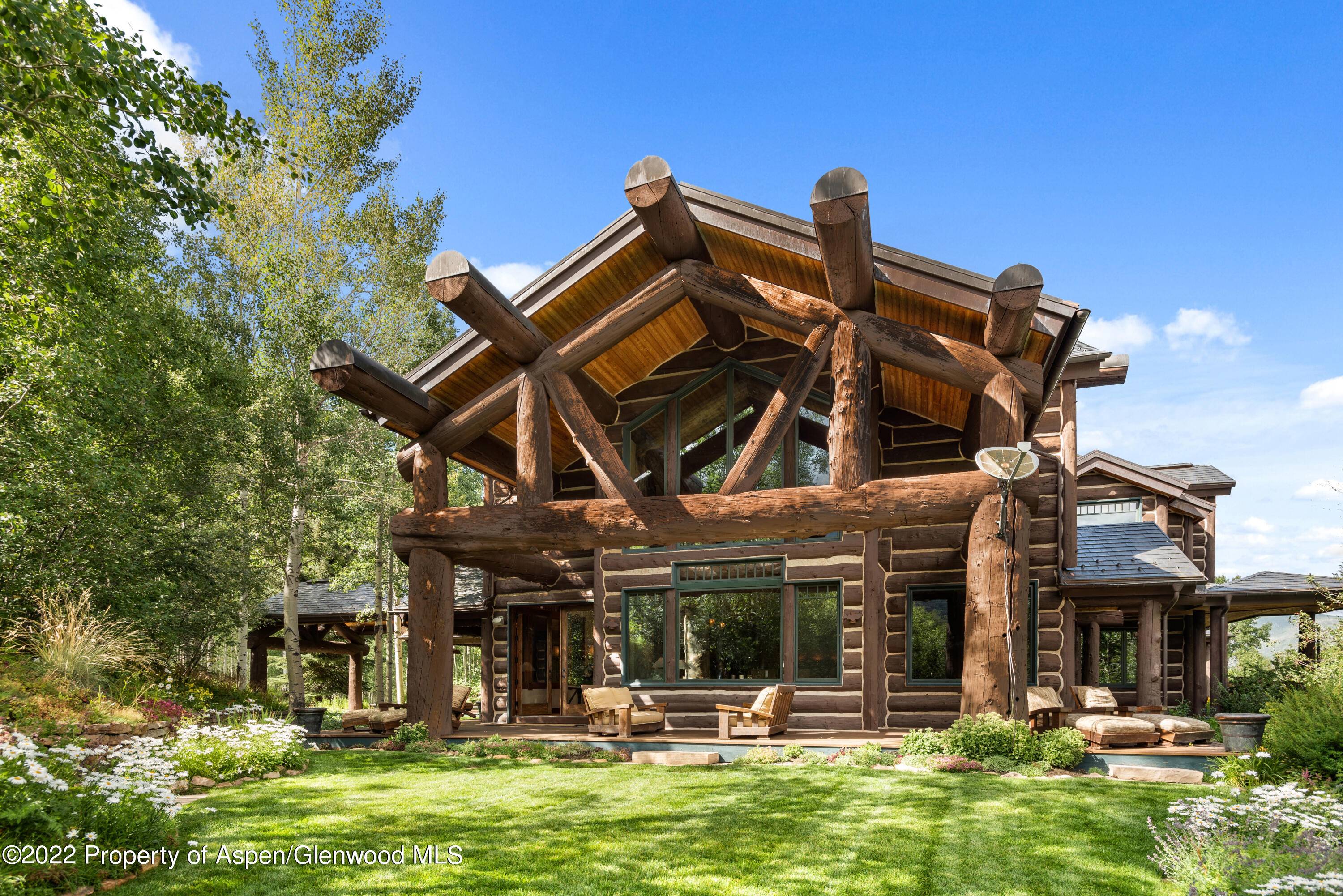 A timeless Colorado lodge on 44 private acres in a stunning alpine setting just minutes up Castle Creek Valley from the Aspen roundabout via a brand new paved drive.