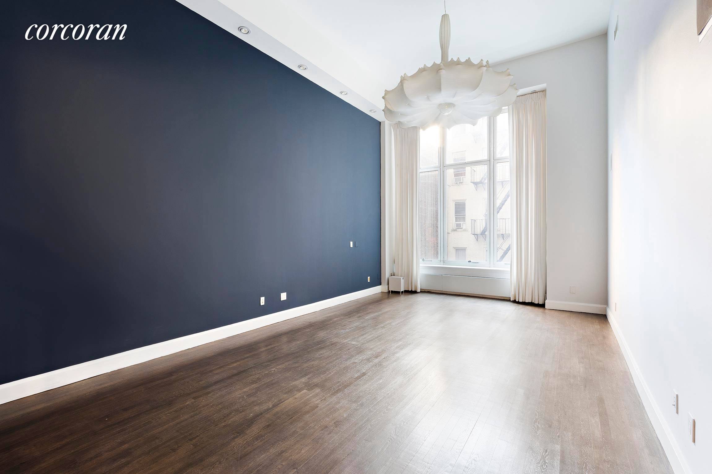 121 West 19th Street, unit 3B, a striking two bedroom, two bath updated duplex apartment in prime Chelsea.