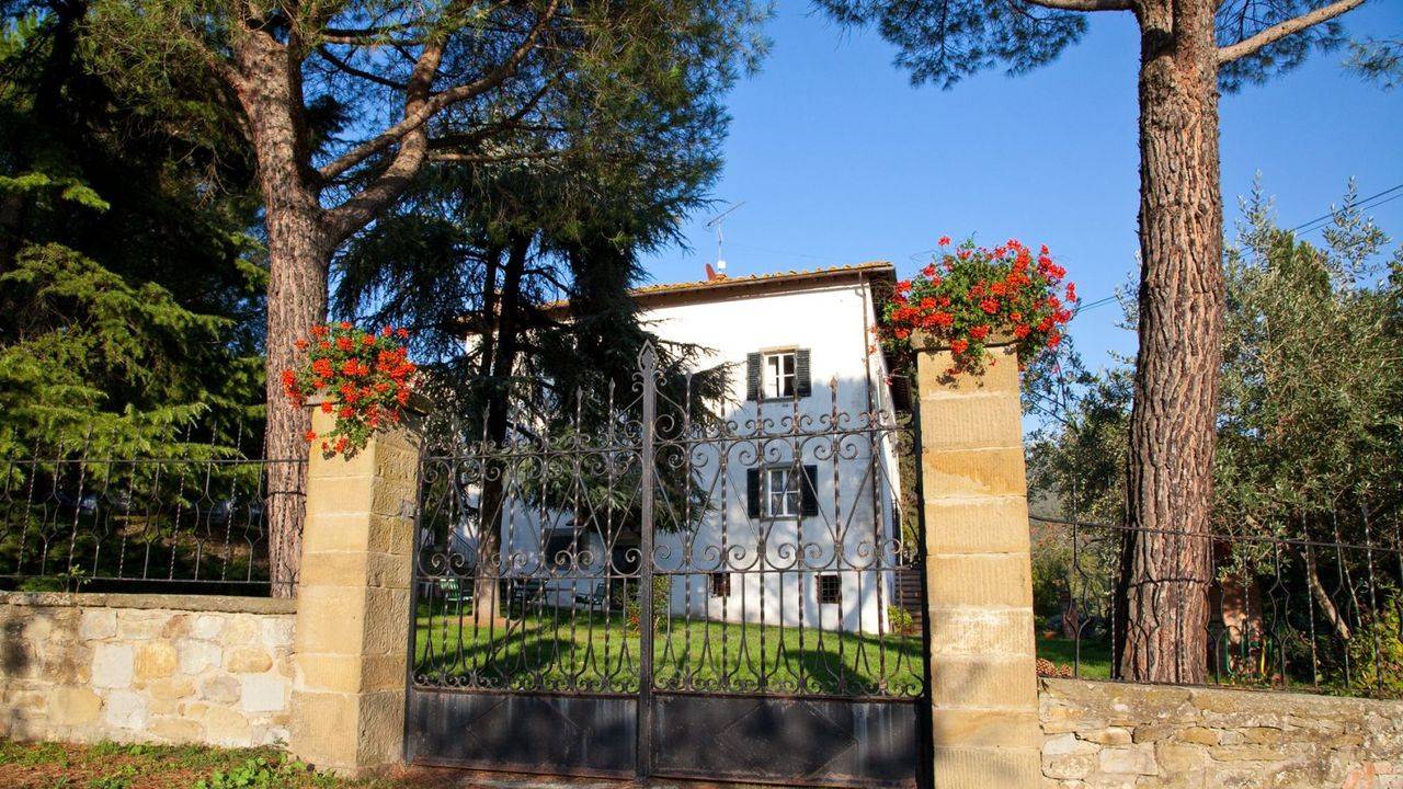 Luxury Villa for sale in Tuscany with stone restored farmhouse, gardens, church, swimming pool. Dominant position on the Val Di Chiana countryside