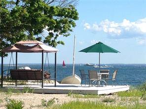 One of a kind vacation spot with private beach and truly panoramic water views of the Westport Norwalk Islands.