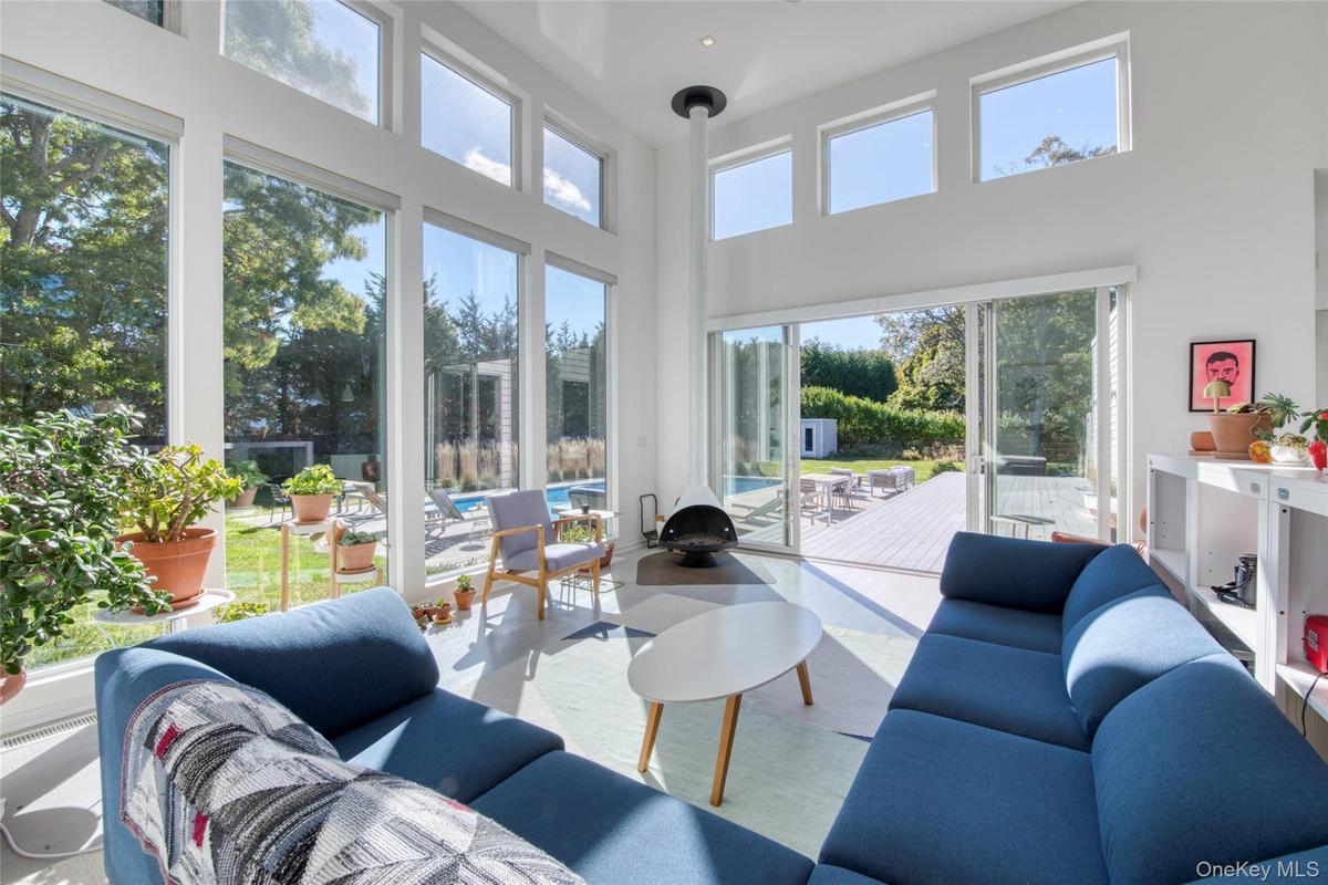 Living room featuring a high ceiling