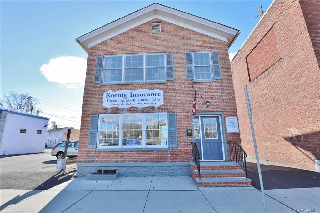 Mixed Use Commercial Residential Solid Brick Building with first floor large Office Space currently used as a professional office suite with a large reception area, 2 additional private office spaces, ...