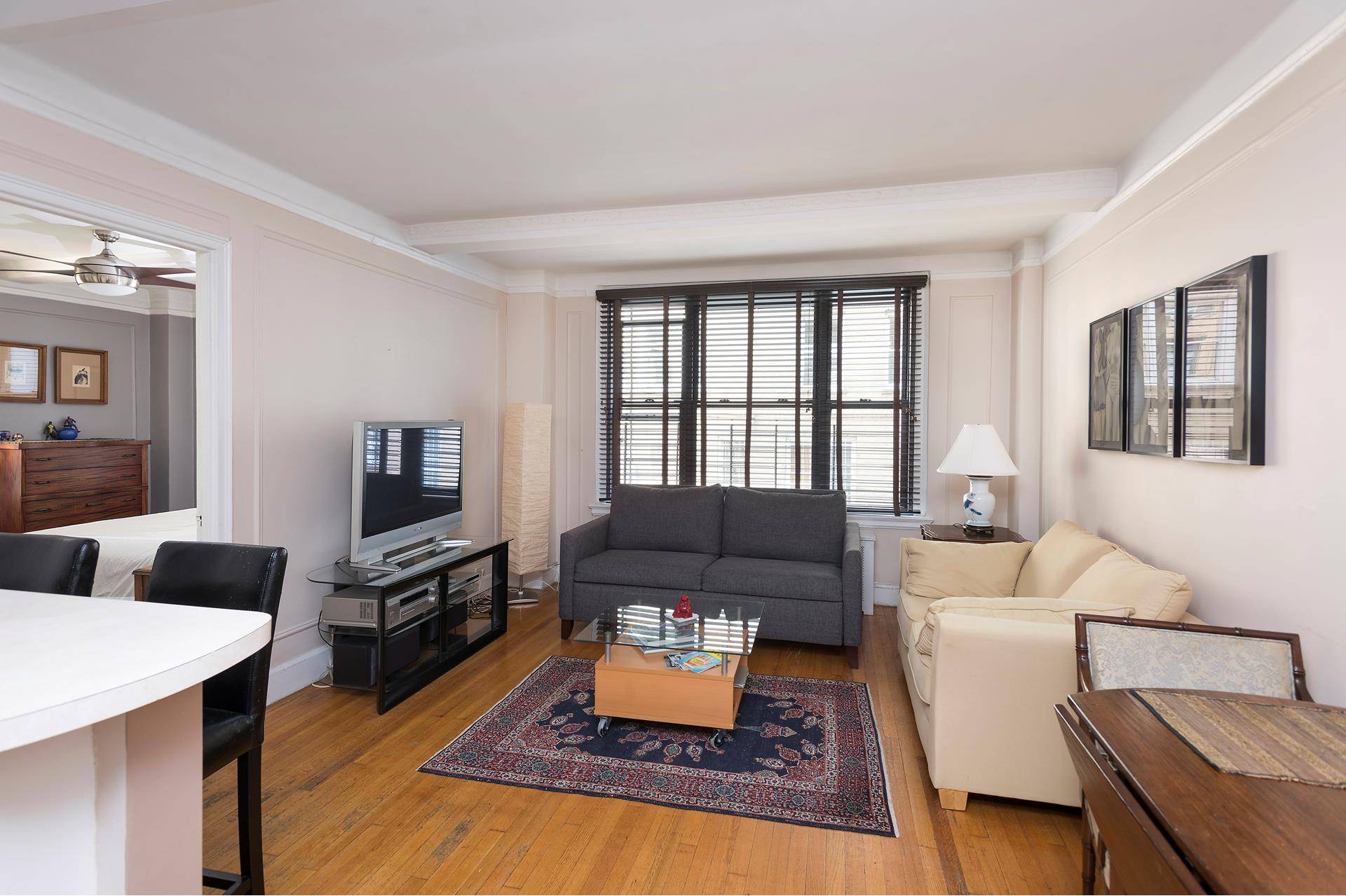 This charming prewar one bedroom, one bath apartment includes an entry foyer that leads into an opened updated kitchen with stainless steel appliances.