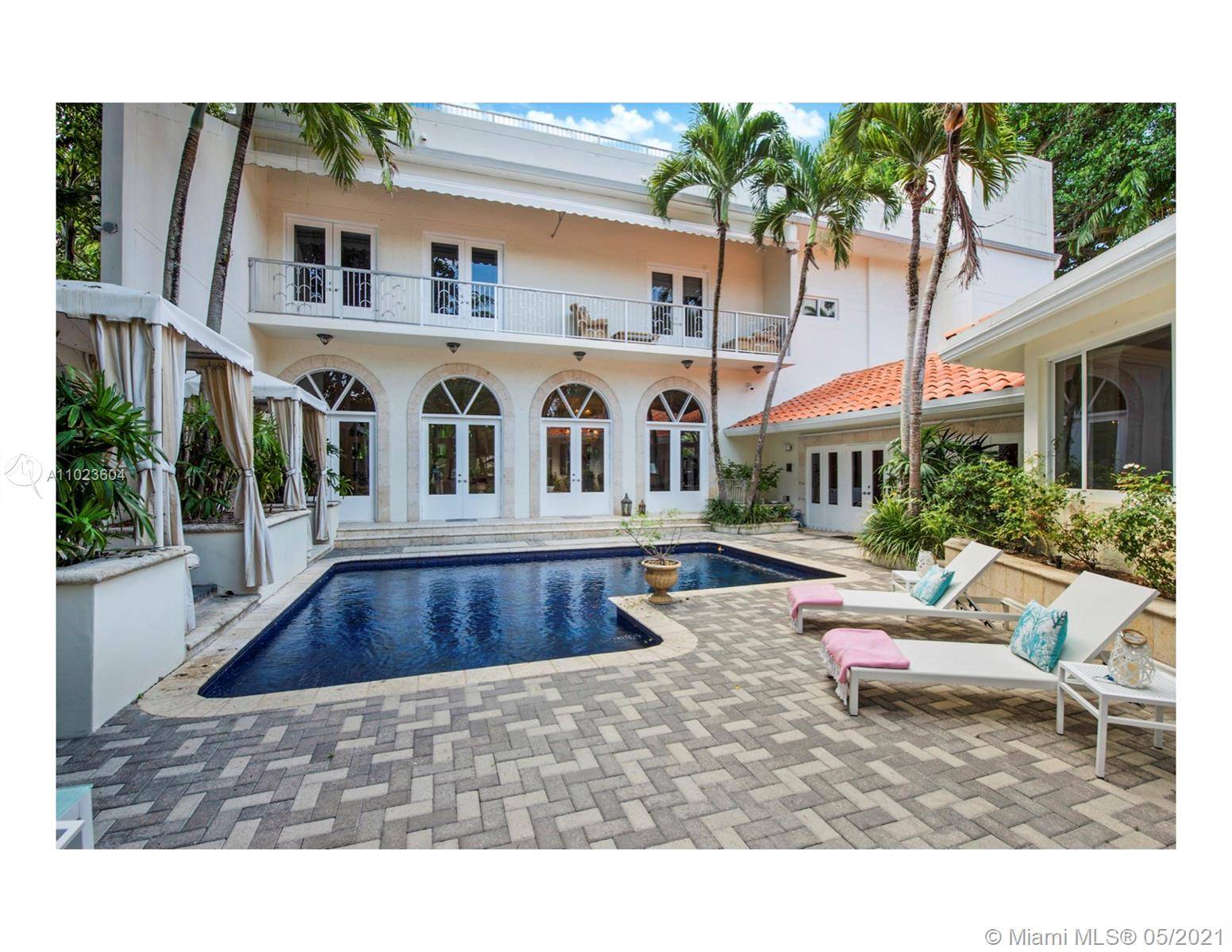 Elegant, walled estate perched high on coral ridge with lush grounds.