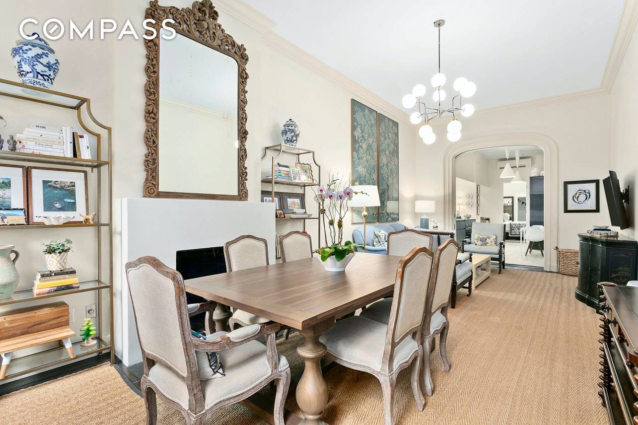 A voluminous two bedroom condominium with an additional windowed bonus room and direct garden access on the parlor floor of an historic brownstone in Cobble Hill.