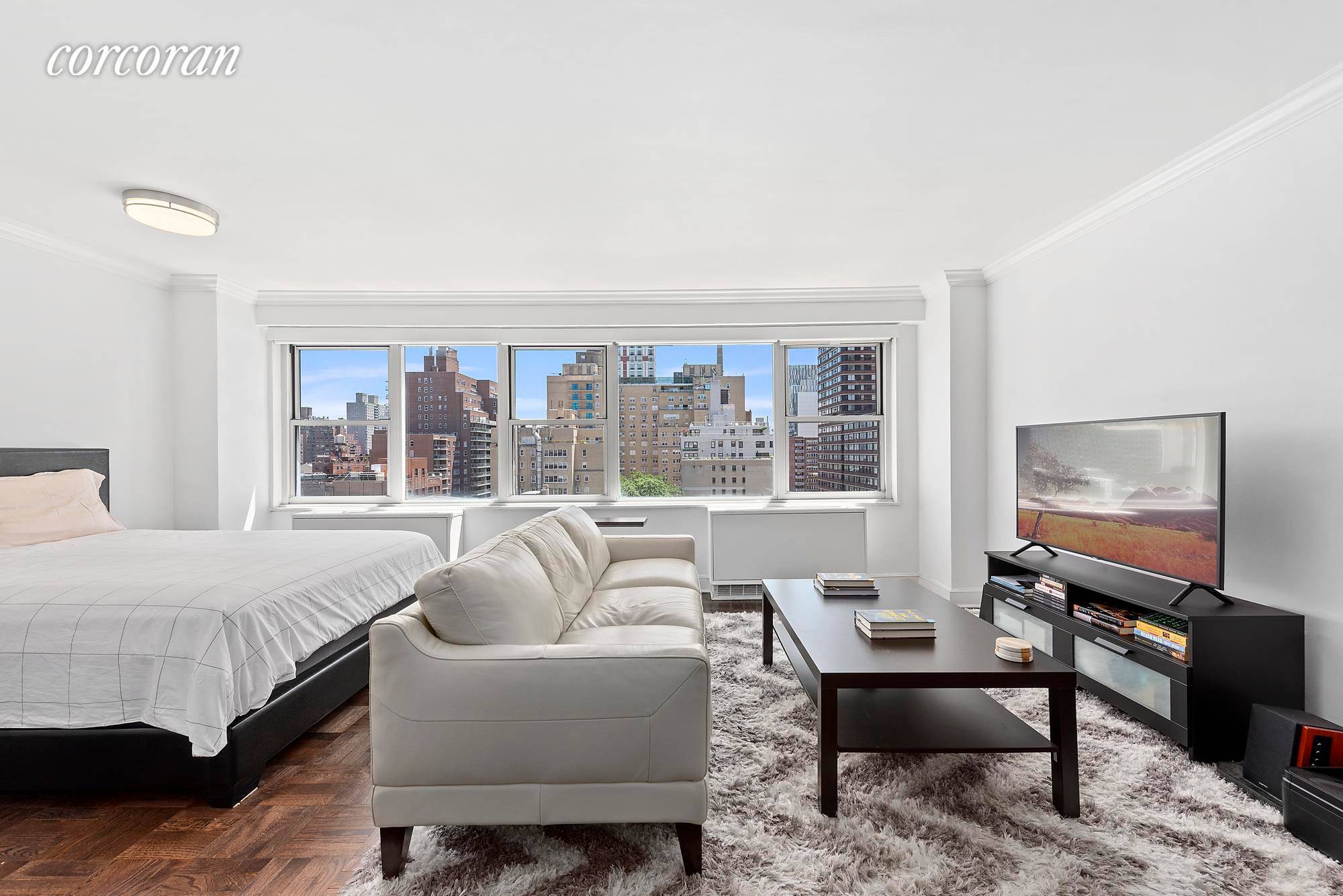 Enjoy beautifully updated interiors, glorious natural light and a spacious convertible one bedroom layout at The Wilshire, a full service Lenox Hill cooperative featuring incredibly low monthly maintenance.