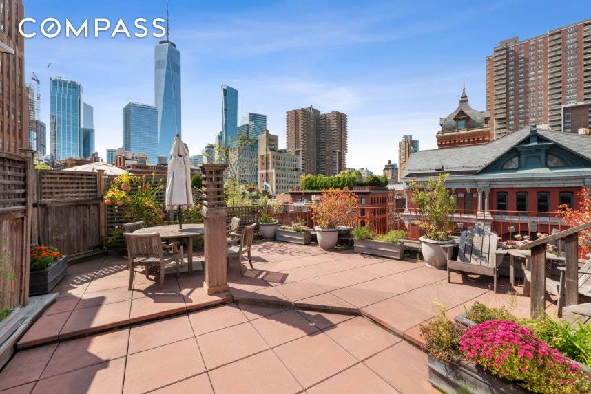 A sundrenched corner co op with period charm and a private outdoor space with sweeping city views.
