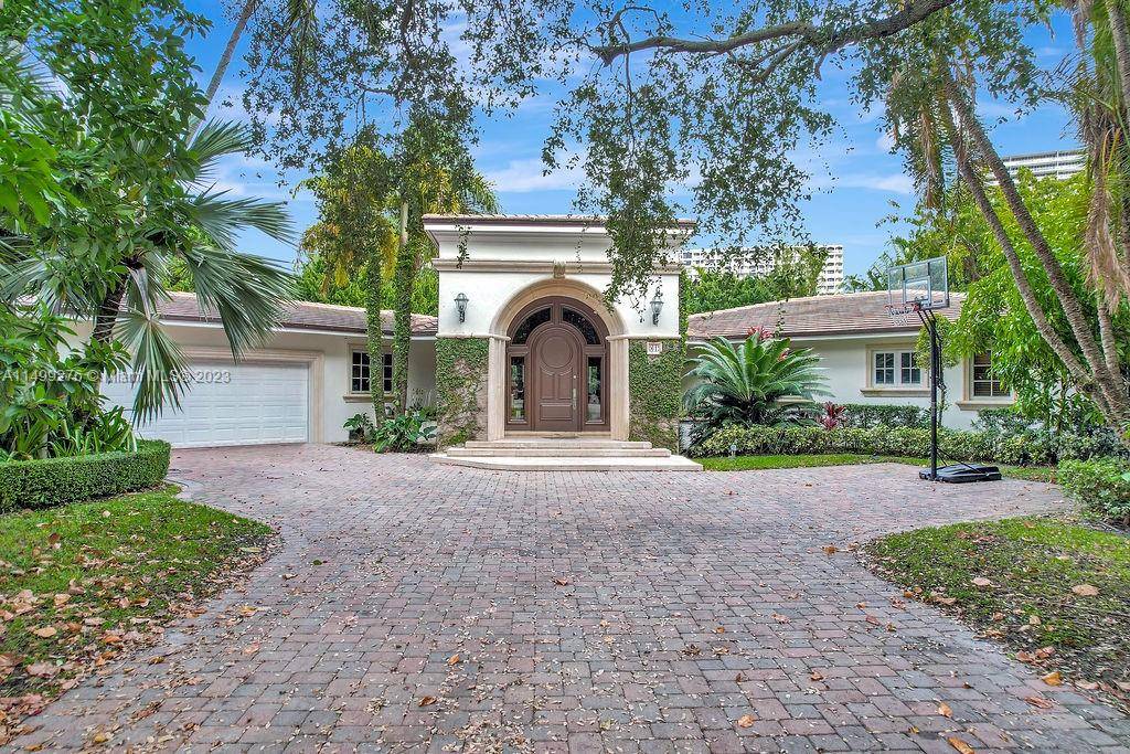 Rare opportunity to live in the exclusive guard gated Bal Harbour Village on an oversized 17, 500 sq.
