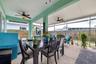 Outdoor dining and recreation can take place on this great lanai