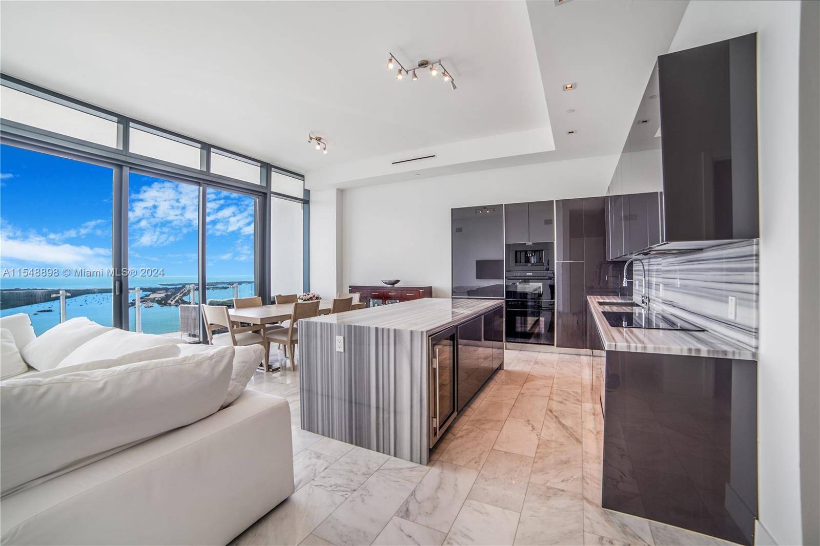 Experience mesmerizing views of Biscayne Bay and the city skyline from this lower PH corner unit in Echo Brickell featuring 3 bedrooms den 3.