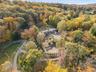 Aerial view of property's location featuring a forest