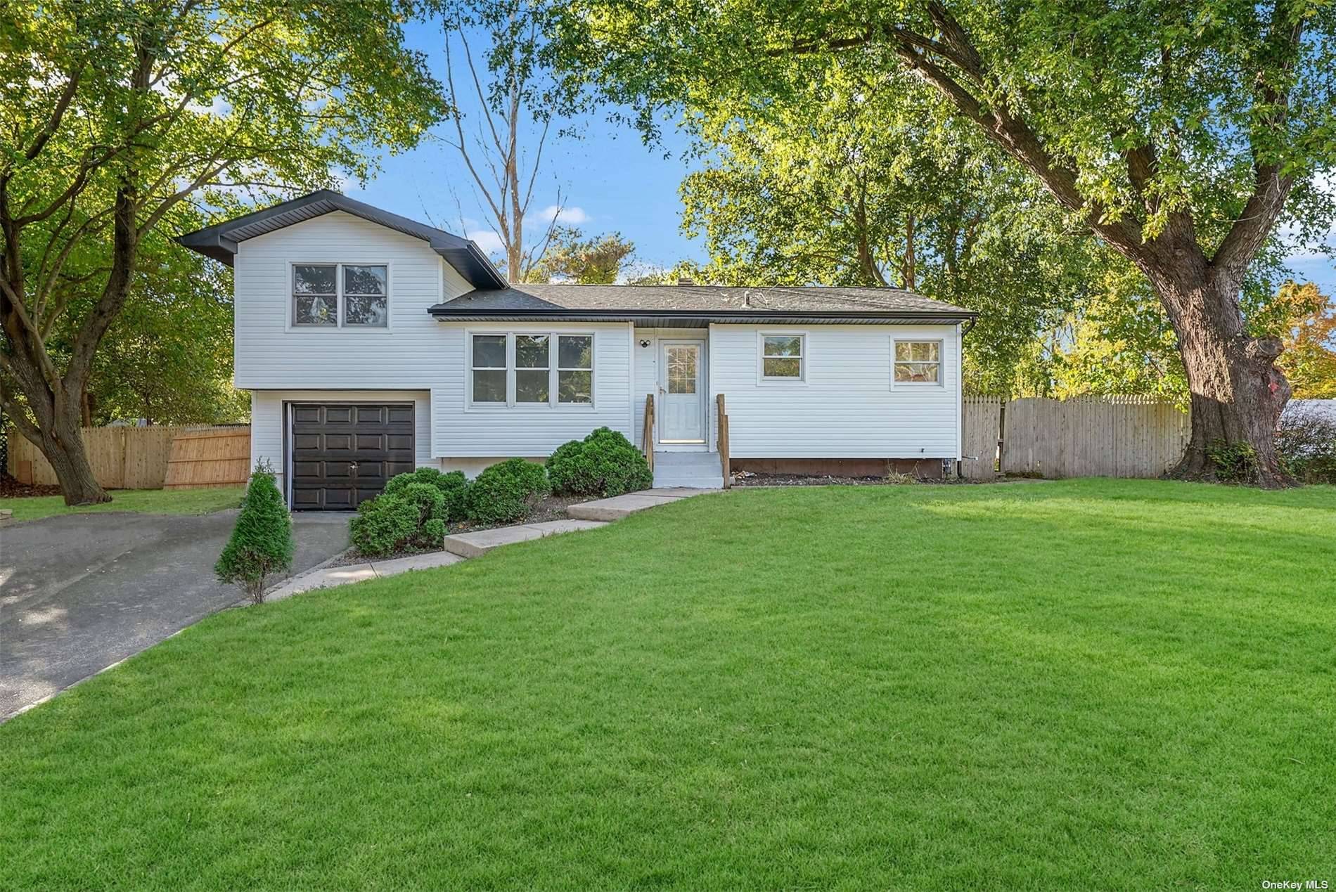 Captivating Fully Renovated Split Ranch Located on Quiet Street in Coram is a MUST SEE.