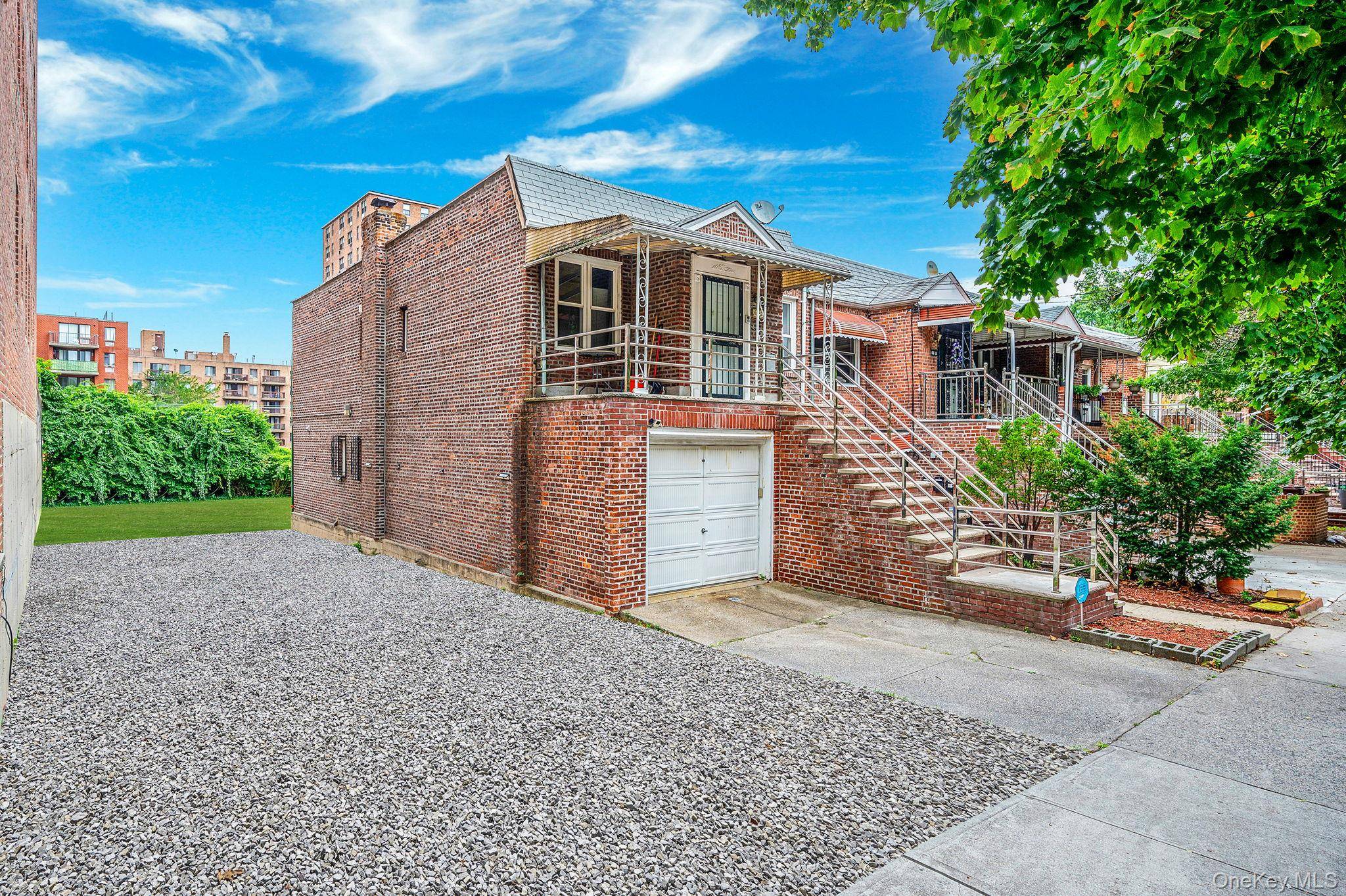 Welcome to 6611 Burns Street, a rare two family brick home in the heart of Rego Park.