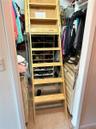 Owners' Suite Closet with Pull Down Attic Stairs